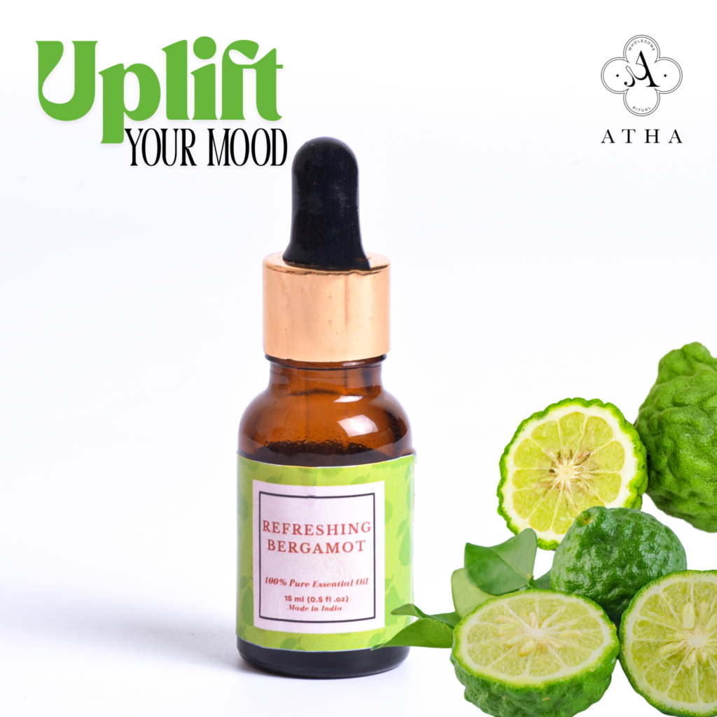 Amber bottle of pure Bergamot essential oil with fresh citrus peels